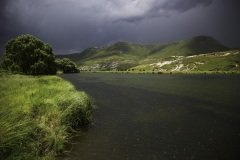 Rain in the mountains with broken clouds.  Mahloti Mountains, Eastern Cape Province, South Africa.