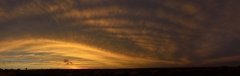 Soft curves in a striking sunset sky.